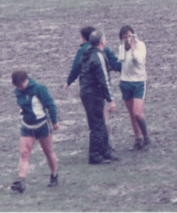 Two weeks later, a heartbroken Thomas is consoled by England manager Martin Reagan after the penalty shoot-out defeat in the 2nd leg at Kenilworth Road