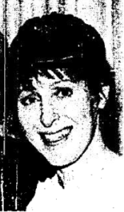 Close up of a smiling woman with short, dark hair