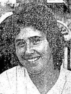 black and white image of a smiling woman's face